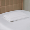 Striped polyester pillow on bed