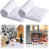 Folded white spotted snow blanket in a festive setting