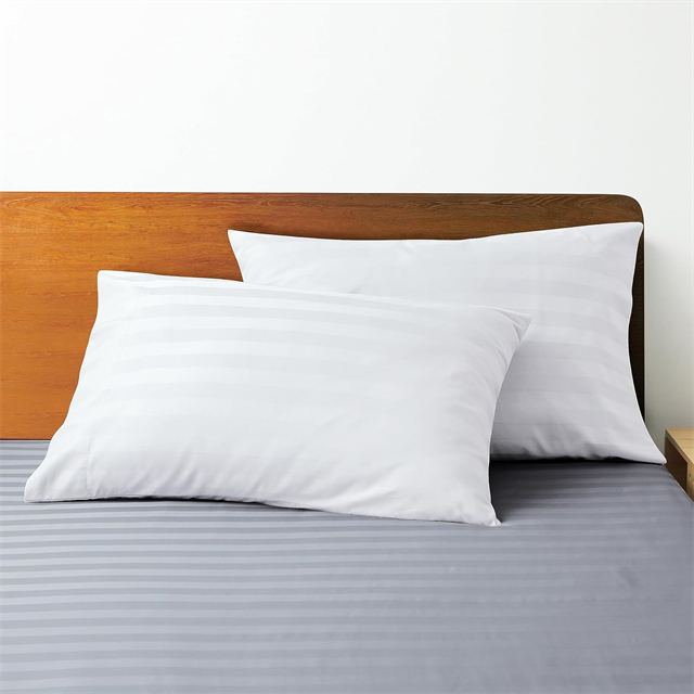 Striped pillows set on bed