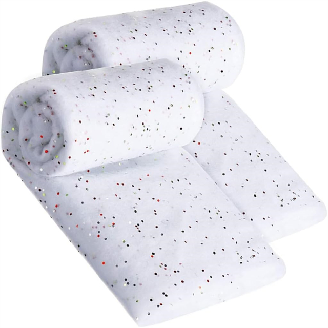 White spotted snow blanket under Christmas