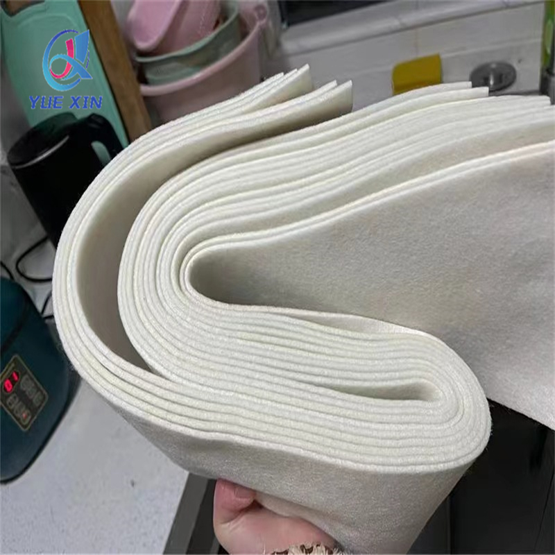White oil absorbent pads unrolled in an industrial facility